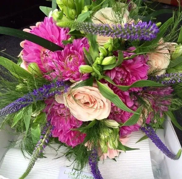 A bouquet of flowers sitting on top of a table.