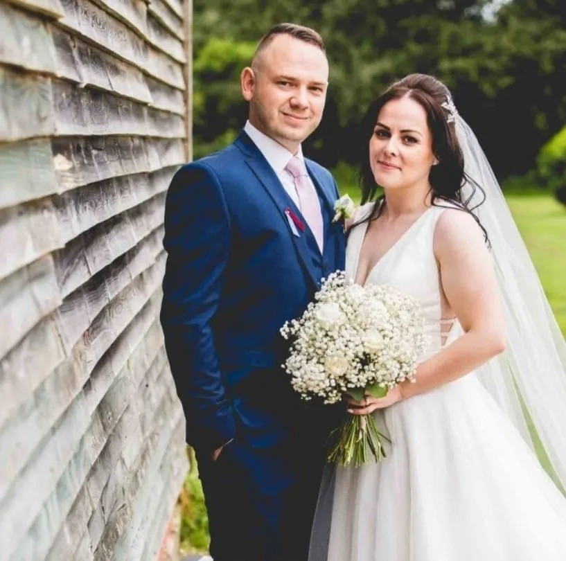 A man and a woman standing next to each other.
